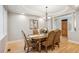 Formal dining room with hardwood floors, decorative chandelier and wainscotting at 4059 Nevis St, Boulder, CO 80301