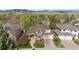 Charming two-story home featuring a well-maintained front yard and a two car garage at 4059 Nevis St, Boulder, CO 80301