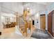 Elegant foyer with a grand staircase, hardwood floors, and a view into the dining room at 4059 Nevis St, Boulder, CO 80301