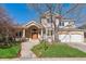 Beautiful two-story house with brick accents, a welcoming front porch, and a well-manicured lawn, offering great curb appeal at 4059 Nevis St, Boulder, CO 80301