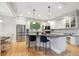 Open kitchen featuring a central island, stainless steel appliances, and sleek cabinetry at 4059 Nevis St, Boulder, CO 80301