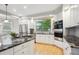 Well-equipped kitchen boasting modern stainless steel appliances, granite countertops, and sleek cabinetry at 4059 Nevis St, Boulder, CO 80301
