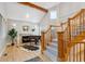 Inviting living room with a fireplace, piano, and hardwood floors at 4059 Nevis St, Boulder, CO 80301