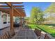 Inviting outdoor dining area on a wooden deck with a pergola, offering a perfect space for entertaining and enjoying meals at 4059 Nevis St, Boulder, CO 80301