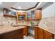 Finished basement featuring wet bar area with granite countertops and storage at 4059 Nevis St, Boulder, CO 80301