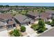 An aerial view of homes with well-manicured lawns, mature trees, and wide streets in a desirable neighborhood at 7201 W Asbury Pl, Lakewood, CO 80227
