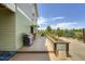 Backyard with deck, grill, garden beds, and drought tolerant landscaping at 7201 W Asbury Pl, Lakewood, CO 80227