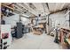 Unfinished basement area featuring work tables and tool storage at 7201 W Asbury Pl, Lakewood, CO 80227