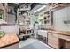 Basement utility area with sink, butcher block countertops, and ample storage at 7201 W Asbury Pl, Lakewood, CO 80227