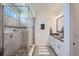 Modern bathroom with glass shower enclosure and stylish tilework at 7201 W Asbury Pl, Lakewood, CO 80227