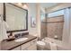 Bathroom showcasing stylish fixtures, tile accents and a tub-shower combination at 7201 W Asbury Pl, Lakewood, CO 80227