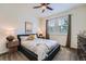 Cozy bedroom with a comfortable bed, natural light, and modern decor at 7201 W Asbury Pl, Lakewood, CO 80227