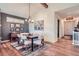 Bright dining room with modern lighting, tasteful decor, and a seamless transition to other living areas at 7201 W Asbury Pl, Lakewood, CO 80227