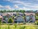 Attractive single-Gathering homes in a suburban neighborhood with green lawns, wooden fences and lush landscaping at 7201 W Asbury Pl, Lakewood, CO 80227