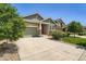 Lovely single-story home with a stone facade, a spacious driveway, and lush green landscaping at 7201 W Asbury Pl, Lakewood, CO 80227