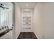 View of hallway built-in shelving leading to the bedroom at 7201 W Asbury Pl, Lakewood, CO 80227