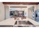 Gourmet kitchen island featuring a stainless steel sink, quartz countertops and open floor plan at 7201 W Asbury Pl, Lakewood, CO 80227