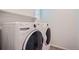 Clean laundry room equipped with a modern washer and dryer set for convenience at 7201 W Asbury Pl, Lakewood, CO 80227