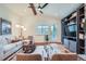 Comfortable living room with vaulted ceilings, stylish furnishings, and access to an outdoor area at 7201 W Asbury Pl, Lakewood, CO 80227