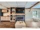 Beautiful living room with a fireplace, shelving and lots of natural light at 7201 W Asbury Pl, Lakewood, CO 80227