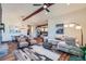 Open-concept living room featuring hardwood floors, a comfortable seating area, and great natural light at 7201 W Asbury Pl, Lakewood, CO 80227