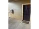 Exterior condo entrance with dark door and welcome mat at 17346 Nature Walk Trl # 201, Parker, CO 80134