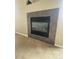 Modern gas fireplace with tile surround at 17346 Nature Walk Trl # 201, Parker, CO 80134