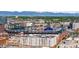 Stunning aerial view of Coors Field and the downtown Denver skyline with Rocky Mountain backdrop at 2150 Curtis St, Denver, CO 80205