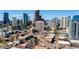 Cityscape view of downtown area featuring skyscrapers, roads, and greenery at 2150 Curtis St, Denver, CO 80205