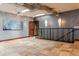 Second-floor hallway featuring travertine floors, industrial ductwork, and staircase at 2150 Curtis St, Denver, CO 80205
