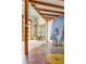 Well-lit living room with a mosaic floor, and yellow-framed glass door at 2150 Curtis St, Denver, CO 80205