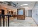 Open floor plan featuring travertine flooring, brick accents, and artistic lighting at 2150 Curtis St, Denver, CO 80205