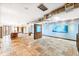 Large living room boasts skylights, ductwork, and travertine floors providing a modern and airy aesthetic at 2150 Curtis St, Denver, CO 80205