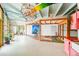 Spacious living room with exposed beams, unique lighting, colorful decor, and natural light at 2150 Curtis St, Denver, CO 80205