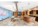 Spacious floor plan with travertine floors, industrial ductwork, island, and ample space at 2150 Curtis St, Denver, CO 80205