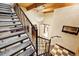 Staircase featuring a unique railing, chandelier, and a view of the house interior at 2150 Curtis St, Denver, CO 80205