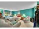 Comfortable bedroom with teal walls, large window, soft lighting, and sitting area at 14300 E Marina Dr # 109, Aurora, CO 80014