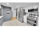 Well-lit kitchen showcasing stainless steel appliances and ample cabinet space at 14300 E Marina Dr # 109, Aurora, CO 80014
