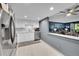 Bright kitchen with stainless steel appliances offering views into the cozy living room at 14300 E Marina Dr # 109, Aurora, CO 80014