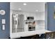 Bright kitchen featuring stainless steel appliances, white cabinets, and granite countertops at 14300 E Marina Dr # 109, Aurora, CO 80014