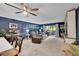 Spacious living room with a ceiling fan and sliding doors leading to the outside at 14300 E Marina Dr # 109, Aurora, CO 80014