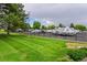 Secure RV/trailer parking lot with a fenced perimeter and well-maintained grassy areas at 14300 E Marina Dr # 109, Aurora, CO 80014