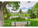 Picturesque pond featuring a fountain, surrounded by lush landscaping and serene walking trails, enhancing community beauty at 14300 E Marina Dr # 109, Aurora, CO 80014