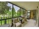 Covered porch with patio seating, grill, and views of trees and neighborhood at 14300 E Marina Dr # 109, Aurora, CO 80014