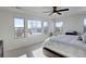 Bright bedroom with large windows, plush bed, and mountain views at 5268 Talavero Pl, Parker, CO 80134