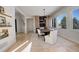 Elegant dining room features a modern dining table and built-in wine storage at 5268 Talavero Pl, Parker, CO 80134