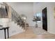 Grand entryway with a statement staircase and modern light fixture at 5268 Talavero Pl, Parker, CO 80134