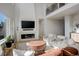 Living room with a modern fireplace and hardwood floors at 5268 Talavero Pl, Parker, CO 80134