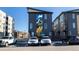 Exterior showing parking and a mural on a modern townhome at 2920 W Parkside Pl, Denver, CO 80221
