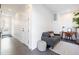 Cozy entry hallway featuring a grey couch, work desk, and bright lighting, creating a welcoming space at 2920 W Parkside Pl, Denver, CO 80221